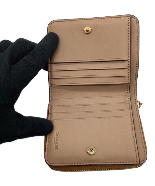 COACH（コーチ）COACH (コーチ) COACH 　ビルフォールド 　ウォレット・ホース アンド キャリッジ プリント 　2つ折り財布 ホワイト×ブラウンの古着・服飾アイテム