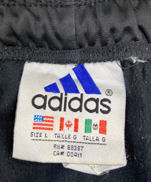 adidas（アディダス）adidas (アディダス) トラックパンツ ブラック×レッド サイズ:Lの古着・服飾アイテム