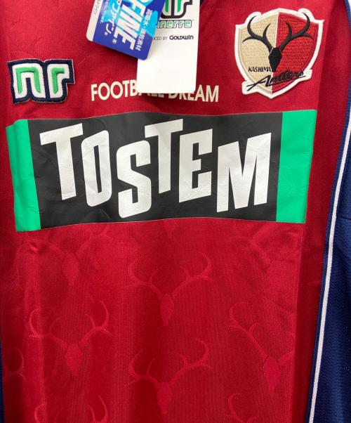 TOSTEM（トステム）TOSTEM (トステム) 鹿島アントラーズ　サッカーユニフォーム ボルドー×ネイビー サイズ:ｌの古着・服飾アイテム