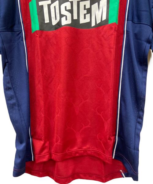 TOSTEM（トステム）TOSTEM (トステム) 鹿島アントラーズ　サッカーユニフォーム ボルドー×ネイビー サイズ:ｌの古着・服飾アイテム