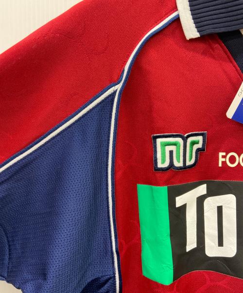 TOSTEM（トステム）TOSTEM (トステム) 鹿島アントラーズ　サッカーユニフォーム ボルドー×ネイビー サイズ:ｌの古着・服飾アイテム