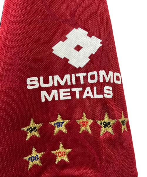 TOSTEM（トステム）TOSTEM (トステム) 鹿島アントラーズ　サッカーユニフォーム ボルドー×ネイビー サイズ:ｌの古着・服飾アイテム