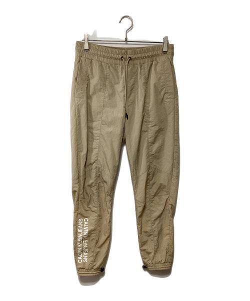 Calvin Klein Jeans（カルバンクラインジーンズ）Calvin Klein Jeans (カルバンクラインジーンズ) ナイロンパンツ ベージュ サイズ:Sの古着・服飾アイテム