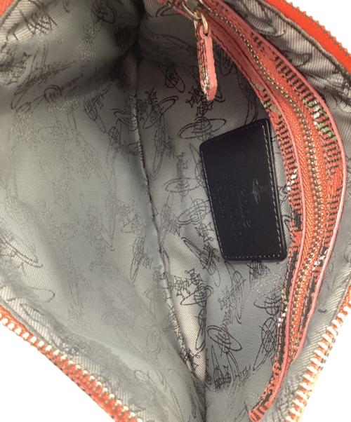 Vivienne Westwood（ヴィヴィアンウエストウッド）Vivienne Westwood (ヴィヴィアンウエストウッド) クラッチバッグ オレンジ×ブラックの古着・服飾アイテム