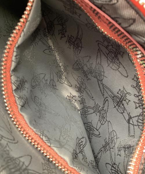 Vivienne Westwood（ヴィヴィアンウエストウッド）Vivienne Westwood (ヴィヴィアンウエストウッド) クラッチバッグ オレンジ×ブラックの古着・服飾アイテム