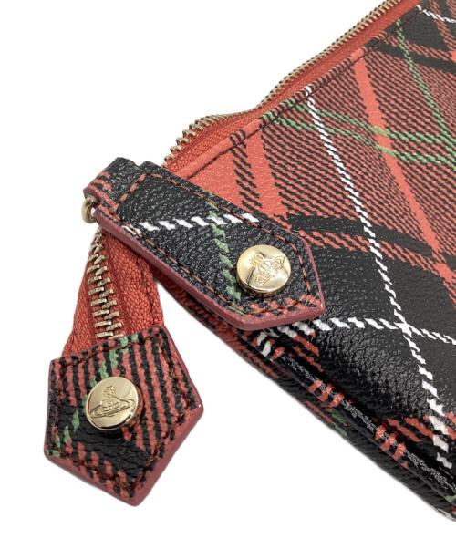 Vivienne Westwood（ヴィヴィアンウエストウッド）Vivienne Westwood (ヴィヴィアンウエストウッド) クラッチバッグ オレンジ×ブラックの古着・服飾アイテム