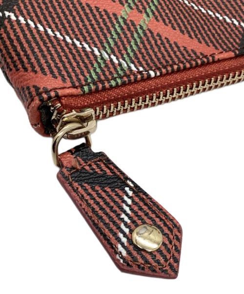 Vivienne Westwood（ヴィヴィアンウエストウッド）Vivienne Westwood (ヴィヴィアンウエストウッド) クラッチバッグ オレンジ×ブラックの古着・服飾アイテム