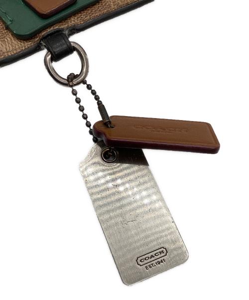 COACH（コーチ）COACH (コーチ) セカンドバッグ　	シグネチャー ベージュ×グリーン×オレンジの古着・服飾アイテム