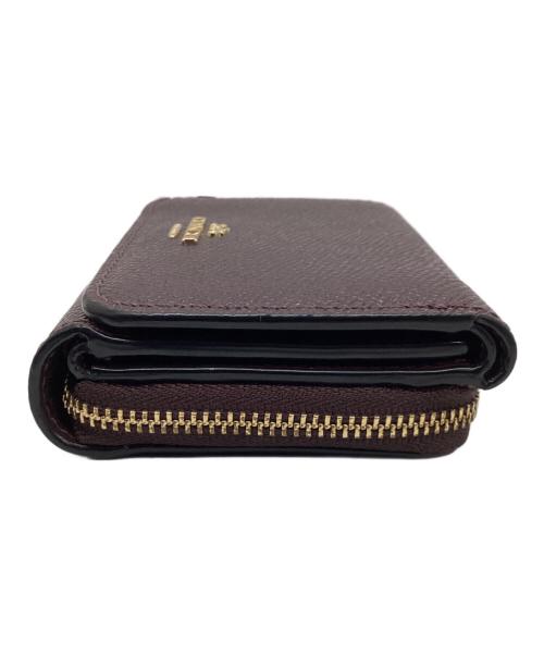 COACH（コーチ）COACH (コーチ) 3つ折り財布 パープルの古着・服飾アイテム