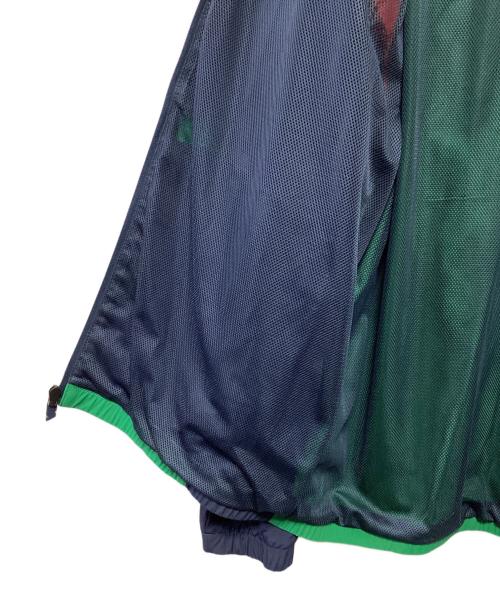 NEW BALANCE（ニューバランス）NEW BALANCE (ニューバランス) アスレチックス ポディウム ウィンドブレーカー ジャケット グリーン×レッド サイズ:L 未使用品の古着・服飾アイテム