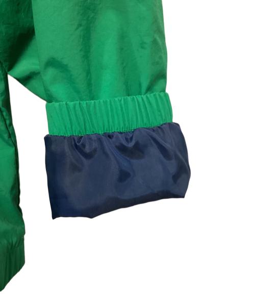 NEW BALANCE（ニューバランス）NEW BALANCE (ニューバランス) アスレチックス ポディウム ウィンドブレーカー ジャケット グリーン×レッド サイズ:L 未使用品の古着・服飾アイテム