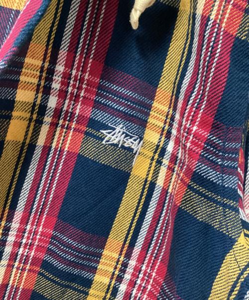 stussy（ステューシー）stussy (ステューシー) フード付ネルシャツ ネイビー×レッド サイズ:SMALLの古着・服飾アイテム