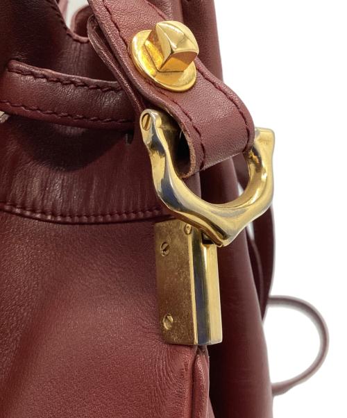 Cartier（カルティエ）Cartier (カルティエ) 巾着ショルダーバッグ レッドの古着・服飾アイテム