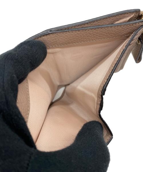 VALENTINO GARAVANI（ヴァレンティノ・ガラヴァーニ）VALENTINO GARAVANI (ヴァレンティノ・ガラヴァーニ) 2つ折り財布 ライトピンクの古着・服飾アイテム