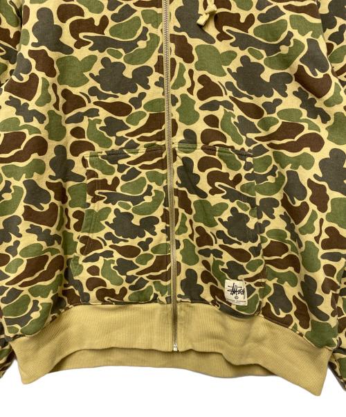 stussy（ステューシー）stussy (ステューシー) CAMO DOUBLE FACE ZIP HOODIE グリーン×ベージュ サイズ:XLの古着・服飾アイテム