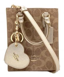 COACH（コーチ）の古着「CX188　シグネチャー」｜ベージュ
