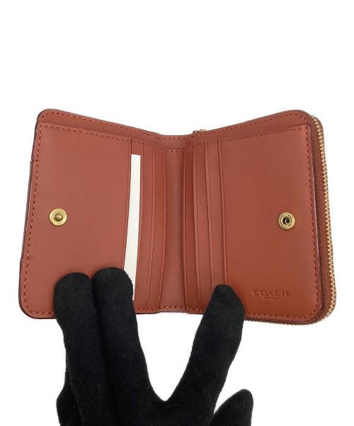 COACH（コーチ）COACH (コーチ) ビルフォールド ウォレット・カラーブロック シグネチャー キャンバス　2つ折り財布 ブラウンの古着・服飾アイテム