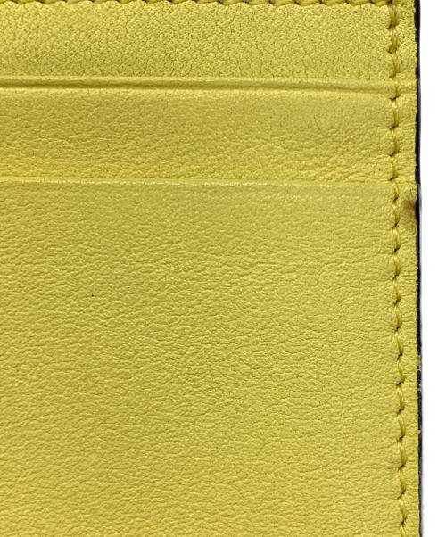 VALENTINO GARAVANI（ヴァレンティノ・ガラヴァーニ）VALENTINO GARAVANI (ヴァレンティノ・ガラヴァーニ) 2つ折り財布 イエローの古着・服飾アイテム