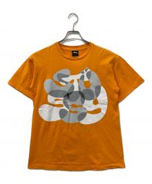 stussy（ステューシー）の古着「プリントTシャツ」｜オレンジ