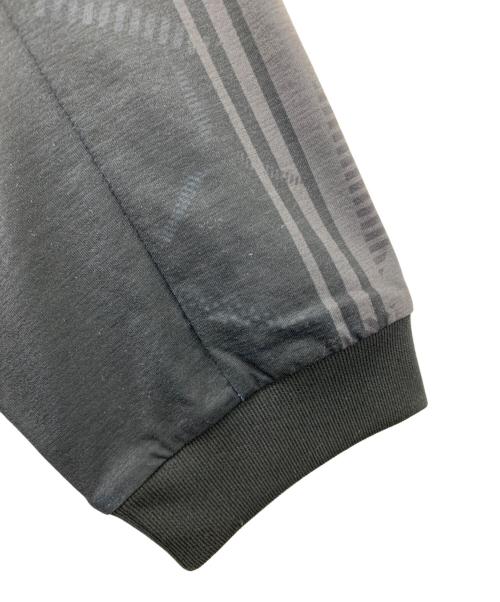 NEW BALANCE（ニューバランス）NEW BALANCE (ニューバランス) Black Out グラフィック ポロロングスリーブシャツ ブラック サイズ:XLの古着・服飾アイテム