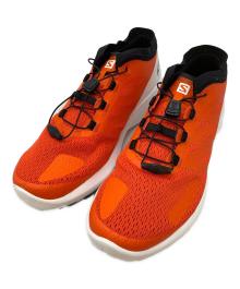 SALOMON（サロモン）の古着「ランニングシューズ」｜オレンジ