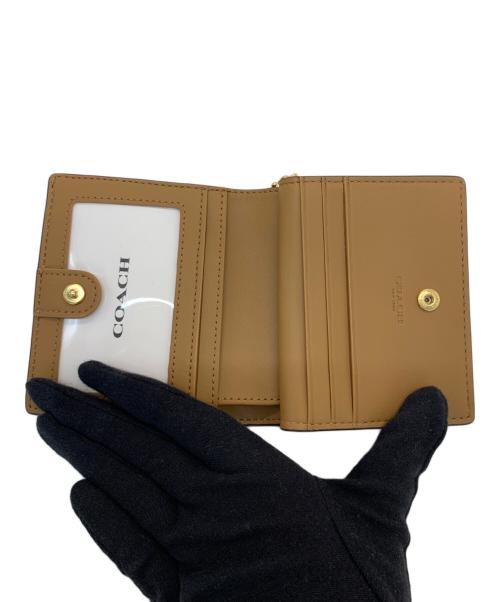 COACH（コーチ）COACH (コーチ) 二つ折り財布 ブラウン×ホワイトの古着・服飾アイテム