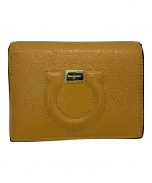 Salvatore Ferragamo（サルヴァトーレ フェラガモ）の古着「2つ折り財布 ガンチーニ」｜オレンジ