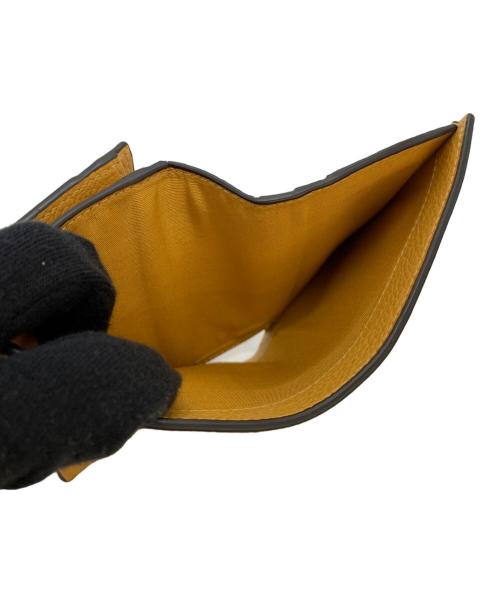 Salvatore Ferragamo（サルヴァトーレ フェラガモ）Salvatore Ferragamo (サルヴァトーレ フェラガモ) 2つ折り財布 ガンチーニ オレンジの古着・服飾アイテム