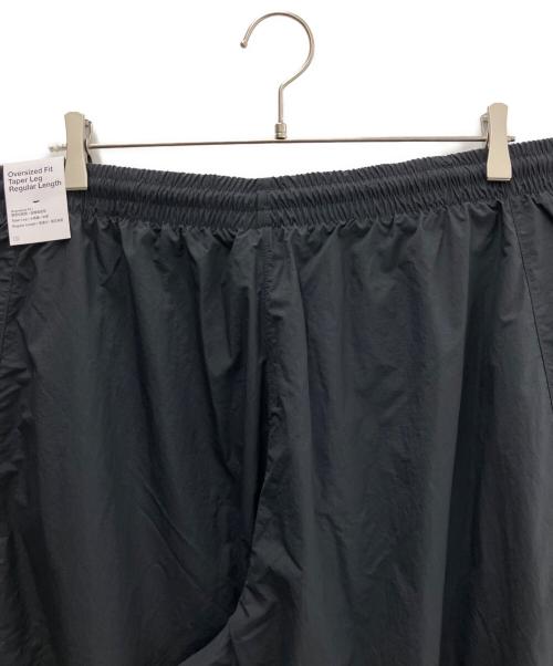 NIKE（ナイキ）NIKE (ナイキ) オーバーサイズド ウーブン トラックパンツ ブラック サイズ:L 未使用品の古着・服飾アイテム