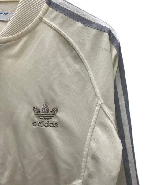 adidas（アディダス）adidas (アディダス) ブルゾン アイボリー×シルバー サイズ:Ｓの古着・服飾アイテム