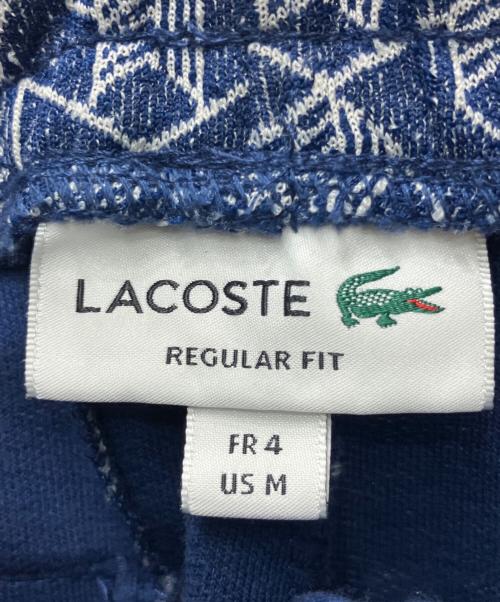 LACOSTE（ラコステ）LACOSTE (ラコステ) LACOSTE(ラコステ)サイドテーピングモノグラムジャカードトラックパンツ ネイビー サイズ:Ｍの古着・服飾アイテム