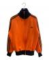 adidas（アディダス）の古着「トラックジャケット」｜オレンジ×ブラック