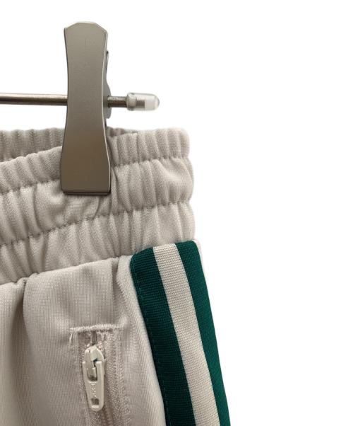 adidas（アディダス）adidas (アディダス) トラックパンツ ベージュ×グリーン サイズ:Ｍ 未使用品の古着・服飾アイテム