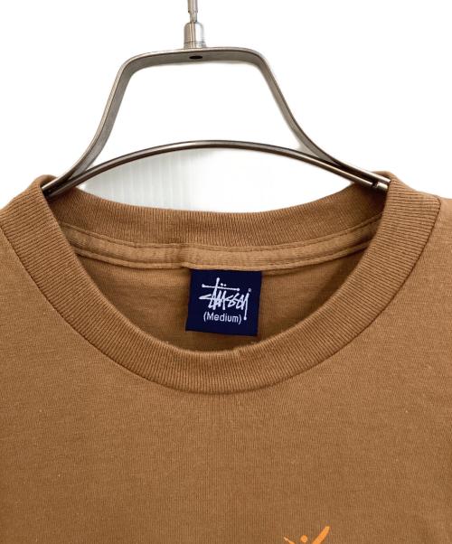 stussy（ステューシー）stussy (ステューシー) プリントTシャツ ブラウン サイズ:SIZE Mの古着・服飾アイテム