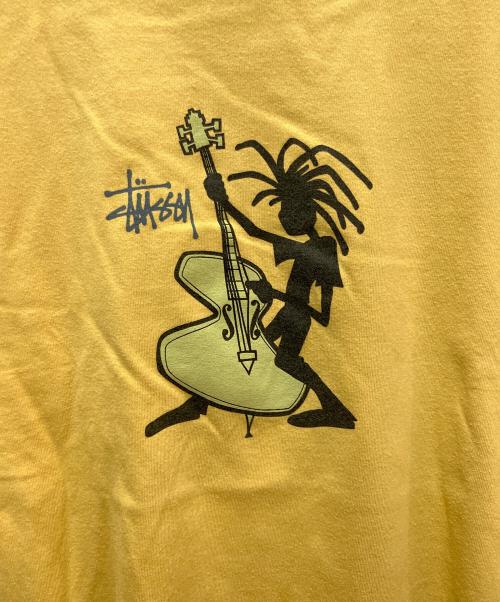 stussy（ステューシー）stussy (ステューシー) プリントTシャツ ジャズマングラフィック イエロー サイズ:Lの古着・服飾アイテム