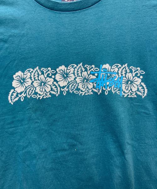 stussy（ステューシー）stussy (ステューシー) プリントTシャツ ハイビスカスグラフィック スカイブルー サイズ:XLの古着・服飾アイテム