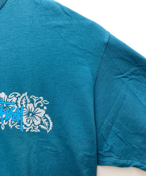 stussy（ステューシー）stussy (ステューシー) プリントTシャツ ハイビスカスグラフィック スカイブルー サイズ:XLの古着・服飾アイテム