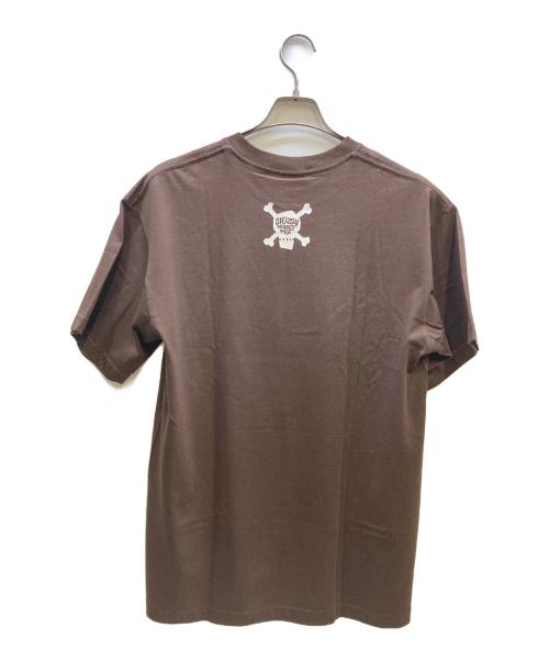 stussy（ステューシー）stussy (ステューシー) WORLD WIDE プリントTシャツ ブラウン サイズ:Lの古着・服飾アイテム