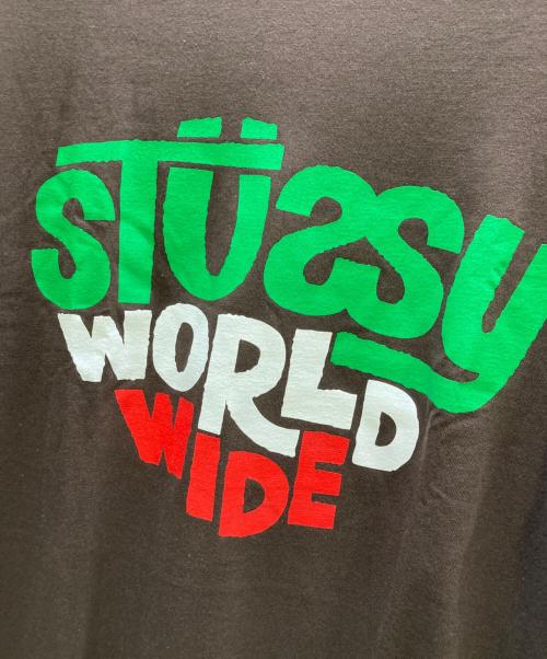 stussy（ステューシー）stussy (ステューシー) WORLD WIDE プリントTシャツ ブラウン サイズ:Lの古着・服飾アイテム