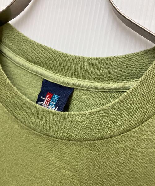 stussy（ステューシー）stussy (ステューシー) プリントTシャツ ロゴキュープグラフィック グリーン サイズ:LARGEの古着・服飾アイテム
