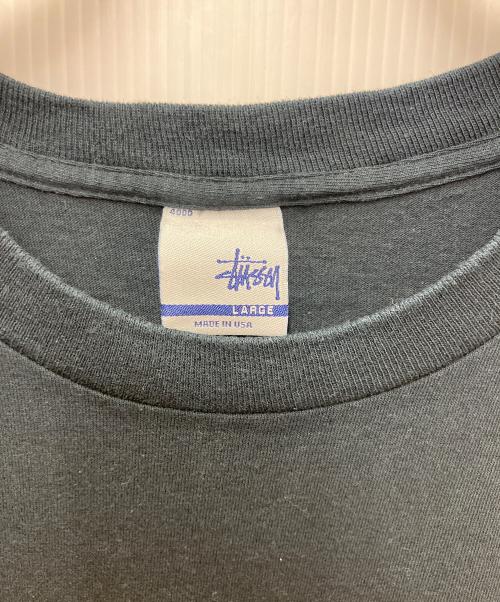 stussy（ステューシー）stussy (ステューシー) プリントTシャツ USロゴプリント ブラック サイズ:LARGEの古着・服飾アイテム