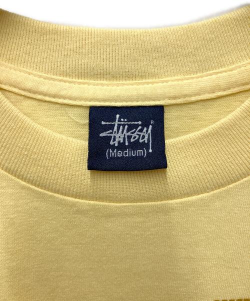 stussy（ステューシー）stussy (ステューシー) プリントTシャツ ボブマーリー ドットプリント イエロー サイズ:Mediumの古着・服飾アイテム