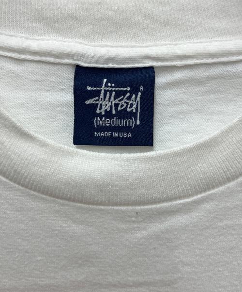 stussy（ステューシー）stussy (ステューシー) プリントTシャツ ロゴダイスプリント ホワイト サイズ:Mediumの古着・服飾アイテム