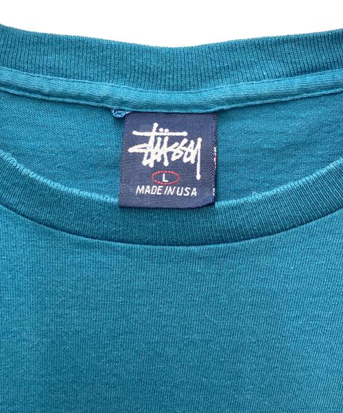stussy（ステューシー）stussy (ステューシー) プリントTシャツ エアポートコード ブルー サイズ:Lの古着・服飾アイテム