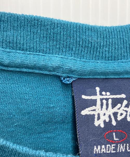 stussy（ステューシー）stussy (ステューシー) プリントTシャツ エアポートコード ブルー サイズ:Lの古着・服飾アイテム