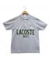 LACOSTE（ラコステ）の古着「オーバーサイズネームプリントポロシャツ」｜スカイブルー