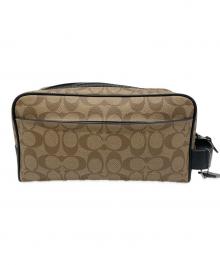 COACH（コーチ）の古着「ラージトラベルキット」｜ブラウン