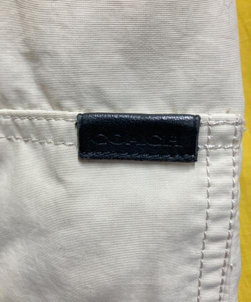 COACH（コーチ）COACH (コーチ) マウンテンパーカー イエロー×ベージュ サイズ:Sの古着・服飾アイテム