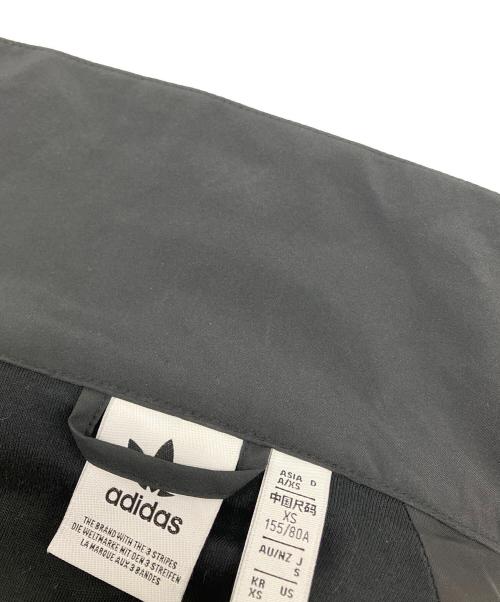 adidas（アディダス）adidas (アディダス) アディレニウム シーズン3 ジップ トラックトップ ブラック サイズ:Sの古着・服飾アイテム