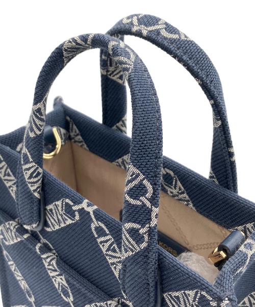 MICHAEL KORS（マイケルコース）MICHAEL KORS (マイケルコース) GIGIエンバイヤシグネチャーロゴエクストラスモール ネイビーの古着・服飾アイテム